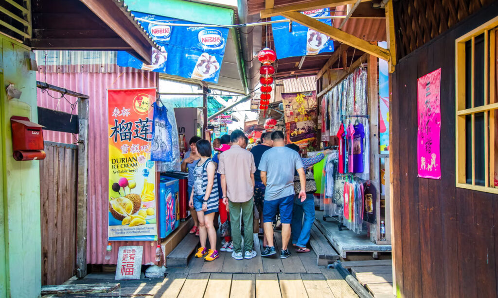 The clan jetties have been overwhelmed by tourists since receiving Unesco world heritage status. Photograph: gracethang/Getty Images