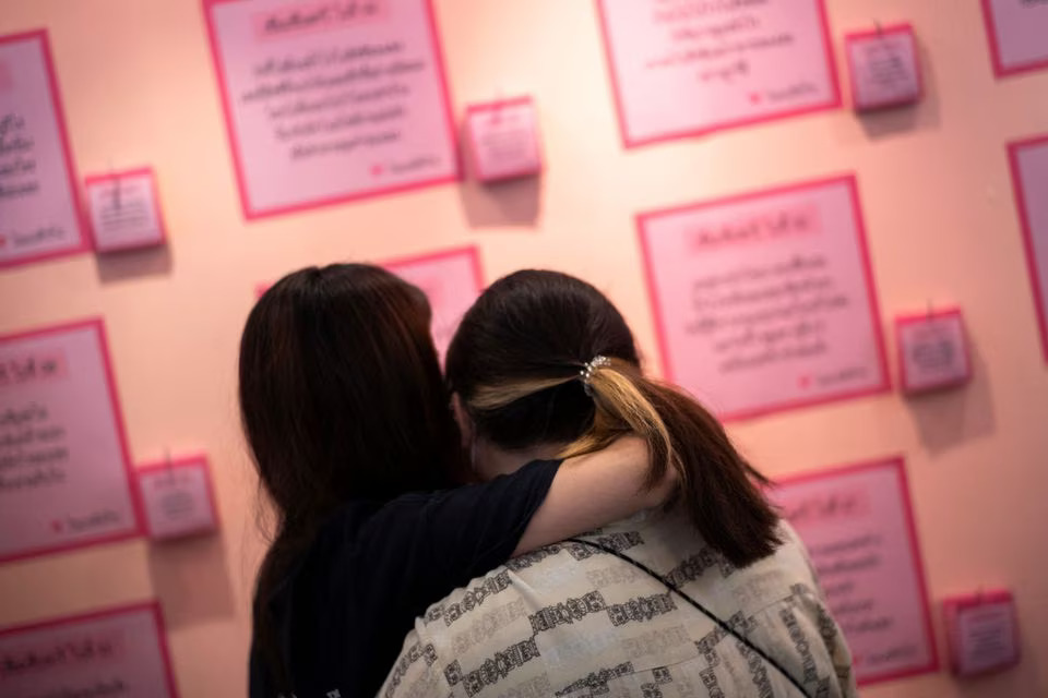 An LGBTQ+ couple attends same-sex marriage registration at a department store, after Thailand's lawmakers passed at first reading four different bills on same-sex unions, in Bangkok, Thailand, June 16, 2022. REUTERS/Athit Perawongmetha