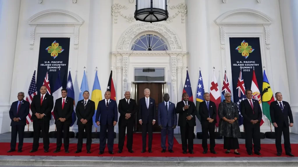 President Joe Biden, center, poses for a photo with Pacific Island leaders on the North Portico of the White House in Washington, Thursday, Sept. 29, 2022 From left, New Caledonia President Louis Mapou, Tonga Prime Minister Siaosi Sovaleni, Palau President Surangel Whipps Jr., Tuvalu Prime Minister Kausea Natano, Micronesia President David Panuelo, Fiji Prime Minister Josaia Voreqe Bainimarama, Biden, Solomon Islands Prime Minister Manasseh Sogavare, Papua New Guinea Prime Minister James Marape, Marshall Islands President David Kabua, Samoa Prime Minister Flame Naomi Mata'afa, French Polynesia President Edouard Fritch and Cook Islands Prime Minister Mark Brown. (AP Photo/Susan Walsh)